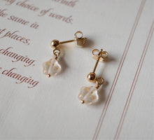 Load image into Gallery viewer, 18K gold plated or surgical steel earrings with 8mm gold foil matte star colored glaze lampwork beads, perfect for adding a touch of elegance and whimsy to any outfit.