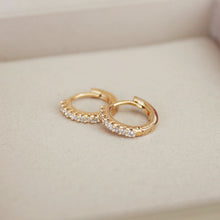 Load image into Gallery viewer, A trio of 18K Gold Plated S925 Huggies in 8mm, 10mm, and 12mm sizes, made from sterling silver and plated with 18K gold.