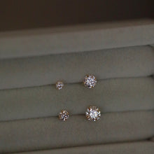 Load image into Gallery viewer, A pair of 14K solid gold stud earrings with cubic zirconia stones available in 3mm, 4mm, and 5mm sizes.