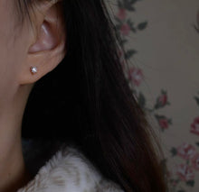 Load image into Gallery viewer, A pair of 14K solid gold stud earrings with cubic zirconia stones available in 3mm, 4mm, and 5mm sizes.