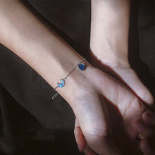 Load image into Gallery viewer, Sterling silver bracelet with a crescent moon and star design, symbolizing dreams and the night sky.