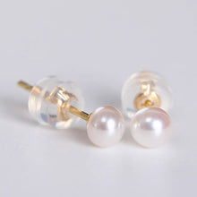 Load image into Gallery viewer, A pair of 14K solid gold earrings featuring lustrous AAA-grade button freshwater pearls, known for their exceptional quality and shine.