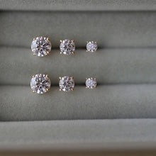 Load image into Gallery viewer, A pair of 14K solid gold stud earrings with cubic zirconia stones available in 3mm, 4mm, and 5mm sizes.