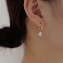 Load image into Gallery viewer, Minimalist 18K gold plated or silver plated hoop earrings with 5mm and 8mm AAA oval freshwater pearls in a huggie style.
