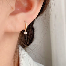 Load image into Gallery viewer, 18K gold-plated hoop earrings with 16mm hoop and small 3mm freshwater button pearls. Elegantly designed for casual or formal wear.