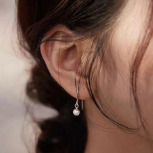 Load image into Gallery viewer, Minimalist surgical steel earrings with 5-6mm button pearls, hypoallergenic and elegant.