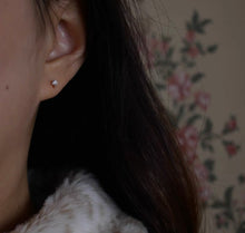 Load image into Gallery viewer, A pair of 14K solid gold stud earrings with cubic zirconia stones available in 3mm, 4mm, and 5mm sizes.