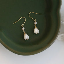 Load image into Gallery viewer, 18K gold plated dangle earrings with 8-9mm natural mother of pearls and white champaca flower accents, hypoallergenic and elegant.