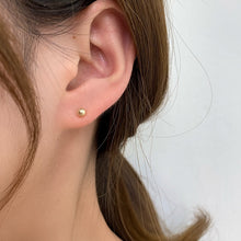 Load image into Gallery viewer, 14K solid gold mini stud earrings, 3mm in size. Perfect for everyday wear, adding a touch of elegance.