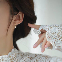 Load image into Gallery viewer, A pair of 18K gold-plated stud earrings with 4mm mini freshwater button pearls.