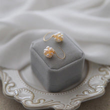 Load image into Gallery viewer, Nickel-free gold dangle earrings with 3-4mm baroque pinkish-orange peach freshwater pearls in a wire-wrapped design.