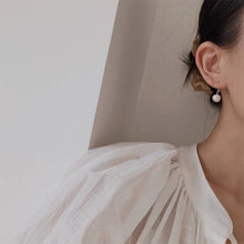 Load image into Gallery viewer, 18K gold plated or steel dangle earrings with 8-8.5mm freshwater AAA off round white pearls, perfect for adding a touch of timeless beauty and sophistication to any outfit.