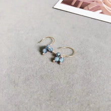 Load image into Gallery viewer, 18K gold-plated dangle earrings with 4mm faceted light blue aquamarine beads. Elegant and sophisticated, perfect for adding a touch of sparkle to your look.