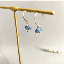 Load image into Gallery viewer, 18K gold-plated dangle earrings with 4mm faceted light blue aquamarine beads. Elegant and sophisticated, perfect for adding a touch of sparkle to your look.