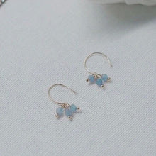 Load image into Gallery viewer, 18K gold-plated dangle earrings with 4mm faceted light blue aquamarine beads. Elegant and sophisticated, perfect for adding a touch of sparkle to your look.