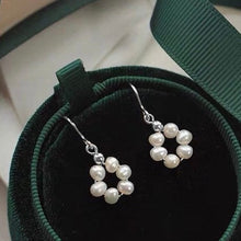 Load image into Gallery viewer, A pair of 18K Gold Plated, surgical steel, or silver dangle earrings with 3mm baroque pearls in a flower circle design. 4o