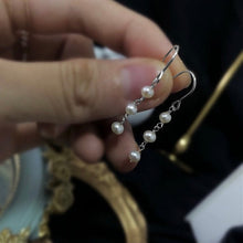 Load image into Gallery viewer, 18K gold plated, silver, or surgical steel dangle earrings with 4mm baroque pearls, perfect for adding an organic and elegant touch to any outfit.