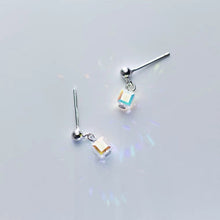 Load image into Gallery viewer, Tiny stud earrings made of surgical steel, featuring 6mm and 8mm clear AB rainbow sugar cube beads, showcasing a minimalist design with a pop of color.