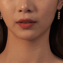 Load image into Gallery viewer, A pair of small earrings plated with 18K gold, featuring two 4mm peach baroque freshwater pearls on a bar.