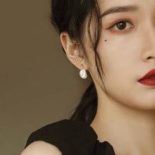 Load image into Gallery viewer, A pair of 18K Gold Plated or silver steel stud earrings with large 10-11mm milky white freshwater Keshi pearls.