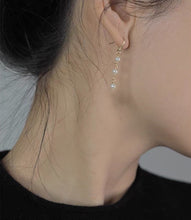 Load image into Gallery viewer, 18K gold plated, silver, or surgical steel dangle earrings with 4mm baroque pearls, perfect for adding an organic and elegant touch to any outfit.