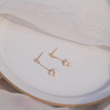 Load image into Gallery viewer, 18K gold plated or steel dainty stud earrings with 3-4mm natural pearls and a chain, perfect for adding a touch of sophistication to any outfit.
