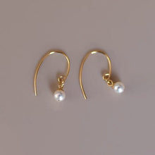 Load image into Gallery viewer, 18K gold plated earrings with AAA-grade 7mm South Sea pearls and delicate flower bead caps, perfect for adding a touch of timeless elegance to any outfit.