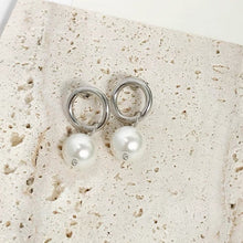 将图片加载到图库查看器,Stainless steel circle stud earrings with 13mm diameter and 8mm crystal pearls. Elegantly designed for a classic yet contemporary look.