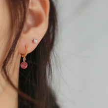 Load image into Gallery viewer, 18K gold plated huggie hoop earrings with AAA-grade natural strawberry quartz 8mm beads, perfect for adding a touch of elegance and femininity to any outfit.