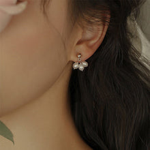 Load image into Gallery viewer, A pair of 18K Gold Plated or surgical steel stud earrings with AAA 4-5mm small oval natural pearls.