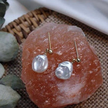 Load image into Gallery viewer, A pair of 18K Gold Plated or silver steel stud earrings with large 10-11mm milky white freshwater Keshi pearls.