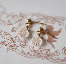 Load image into Gallery viewer, 18K gold plated or surgical steel earrings with 8mm gold foil matte star colored glaze lampwork beads, perfect for adding a touch of elegance and whimsy to any outfit.