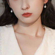 Load image into Gallery viewer, 18K gold plated or 925 silver Korean fashion dangle earrings with 6-7mm natural freshwater pearls, perfect for adding a touch of sophistication and timeless beauty to any outfit.
