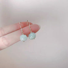 将图片加载到图库查看器,A pair of 18K Gold Plated or S925 Silver earrings with 10mm light green pumpkin jade jadeite gemstones.