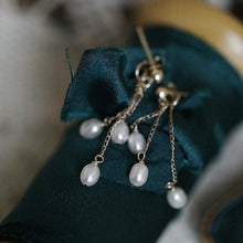 Load image into Gallery viewer, A pair of 18K Gold Plated or surgical steel earrings with 4-5mm oval AAA freshwater pearls, 5cm in length, ideal for wedding bridal and bridesmaid gifts.