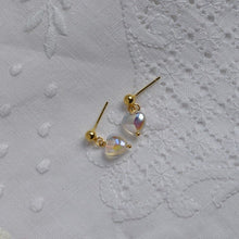 Load image into Gallery viewer, 18K gold plated or surgical steel earrings with 8mm clear AB love heart rainbow glass colored glaze lampwork beads, perfect for adding a touch of whimsy and charm to any outfit.