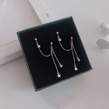 Load image into Gallery viewer, Surgical steel double piercing chain earrings with a 10mm star charm and 7cm length, perfect for a unique and stylish look.