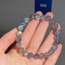 Load image into Gallery viewer, A bracelet made of AAA labradorite round beads in 6mm and 8mm sizes, showcasing stunning iridescence and color play, with a stretchy design for a comfortable fit.