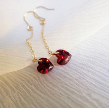 Load image into Gallery viewer, 18K gold plated or surgical steel dangle earrings with 6mm cubic zirconia red hearts, perfect for adding a touch of romance and glamour to any outfit.