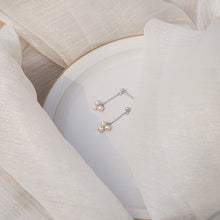 Load image into Gallery viewer, 18K gold plated or steel dainty stud earrings with 3-4mm natural pearls and a chain, perfect for adding a touch of sophistication to any outfit.