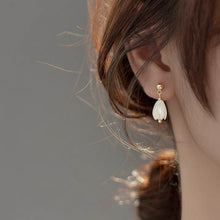 Load image into Gallery viewer, A pair of 18K Gold Plated or surgical steel earrings with white Champaca flower designs made from mother of pearl, measuring 8-9mm.