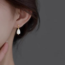 Load image into Gallery viewer, A pair of 18K Gold Plated or surgical steel earrings with white Champaca flower designs made from mother of pearl, measuring 8-9mm.