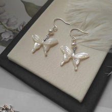 Load image into Gallery viewer, 18K gold plated or surgical steel earrings with a 16mm natural mother of pearl butterfly design and AAA 4mm pearls, perfect for a wedding gift or special occasion.