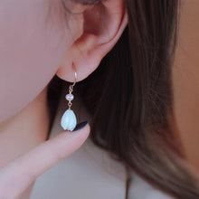 Load image into Gallery viewer, 18K gold plated dangle earrings featuring 8-9mm natural mother of pearl white champaca flowers, perfect for adding elegance and sophistication to any outfit.