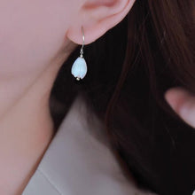 Load image into Gallery viewer, A pair of 18K Gold Plated or surgical steel earrings with white Champaca flower designs made from mother of pearl, measuring 8-9mm.