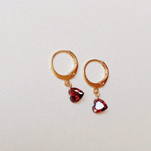 Load image into Gallery viewer, 18K gold plated steel hoop earrings with a 6mm garnet heart-shaped zirconia and white round zirconia accents, perfect for adding a touch of elegance and sparkle to any outfit.