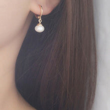 Load image into Gallery viewer, 18K gold-plated hoop earrings with 4mm half-drilled button pearls. Huggie style for comfortable all-day wear, adding a classic accent to any outfit.
