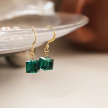 Load image into Gallery viewer, A pair of 18K gold plated dangle earrings featuring 6mm sugar cube green beads, offering a vibrant touch to the sophisticated gold setting.