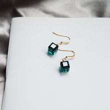Load image into Gallery viewer, A pair of 18K gold plated dangle earrings featuring 6mm sugar cube green beads, offering a vibrant touch to the sophisticated gold setting.