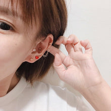 将图片加载到图库查看器,Pair of hypoallergenic surgical stainless steel double piercing earrings, featuring heart studs connected by a delicate chain, plated in gold